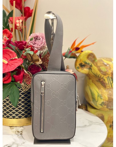 (LIKE NEW) GUCCI SLING BACKPACK IN GREY GG EMBOSSED CALFSKIN LEATHER