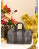 LOUIS VUITTON KEEPALL BANDOULIERE 25 IN BLACK DAMOFLAGE COATED CANVAS