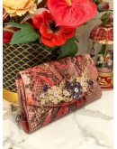 JUDITH LEIBER EXPLORES CRYSTAL AND EXOTICE IN MUTICOLOR PYTHON LEATHER DINNER CLUTCH