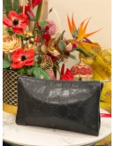 GUCCI EMBOSSED MONOGRAM POUCH