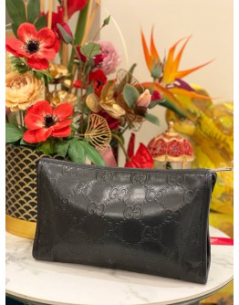 GUCCI EMBOSSED MONOGRAM POUCH
