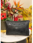 GUCCI EMBOSSED MONOGRAM POUCH