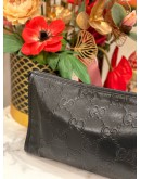 GUCCI EMBOSSED MONOGRAM POUCH
