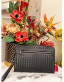 BOTTEGA VENETA INTRECCIATO LEATHER ZIPEED CLUTCH IN BLACK