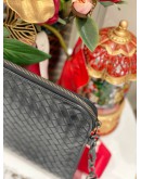 BOTTEGA VENETA INTRECCIATO LEATHER ZIPEED CLUTCH IN BLACK